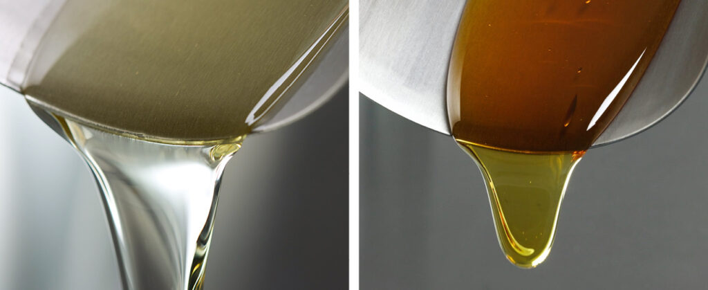 A two way split image from left to right light yellow coloured inver sugar syrup drips off a metal spoon, left rich caramel coloured golden syrup drips off a silver spoon