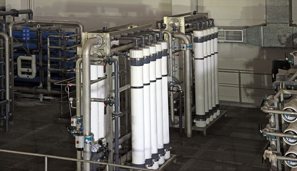 A collection of industrial tubes in a factory setting
